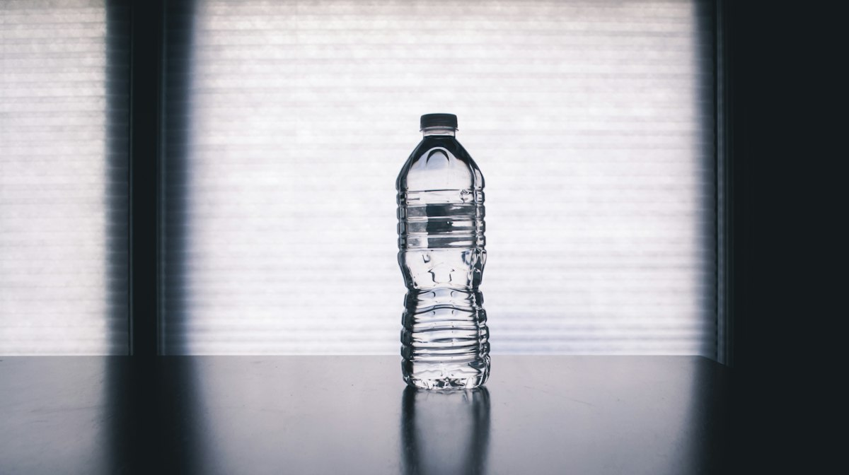 Clear water in a glass against a soft background
